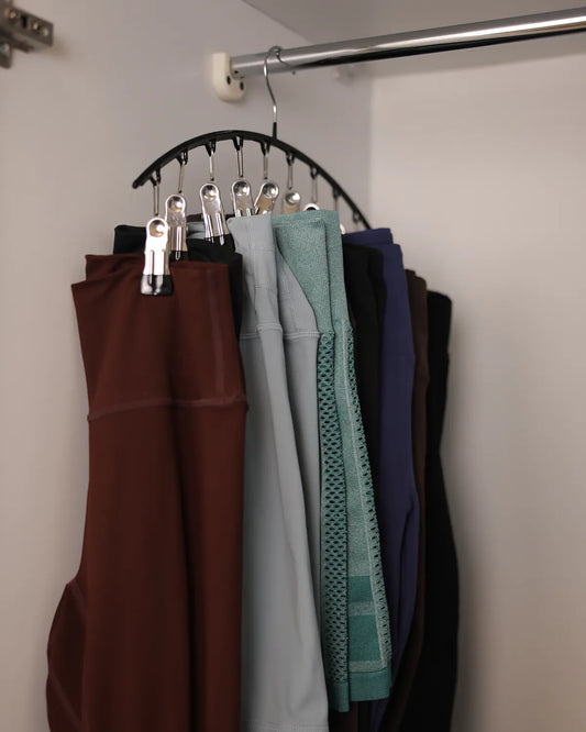 Legging hanger holding 10 leggings in a closet