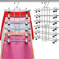 Skirt hanger holding skirts by their clips, four come in The Family Closet Set